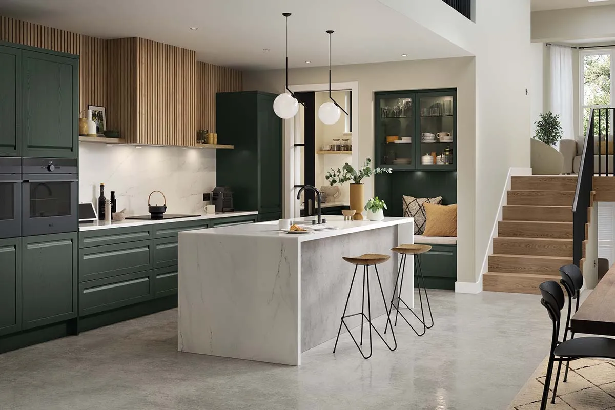 Shaker-style kitchen with integrated handle painted heritage green