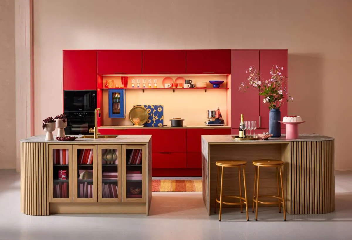 Modern style soft red and dark pink kitchen with oak twin islands