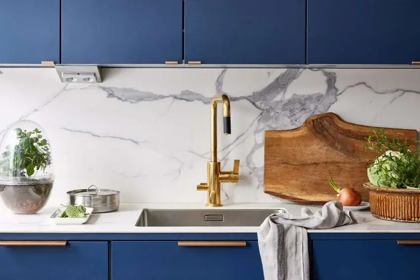 Modern style blue kitchen showing ceramic marble splashback