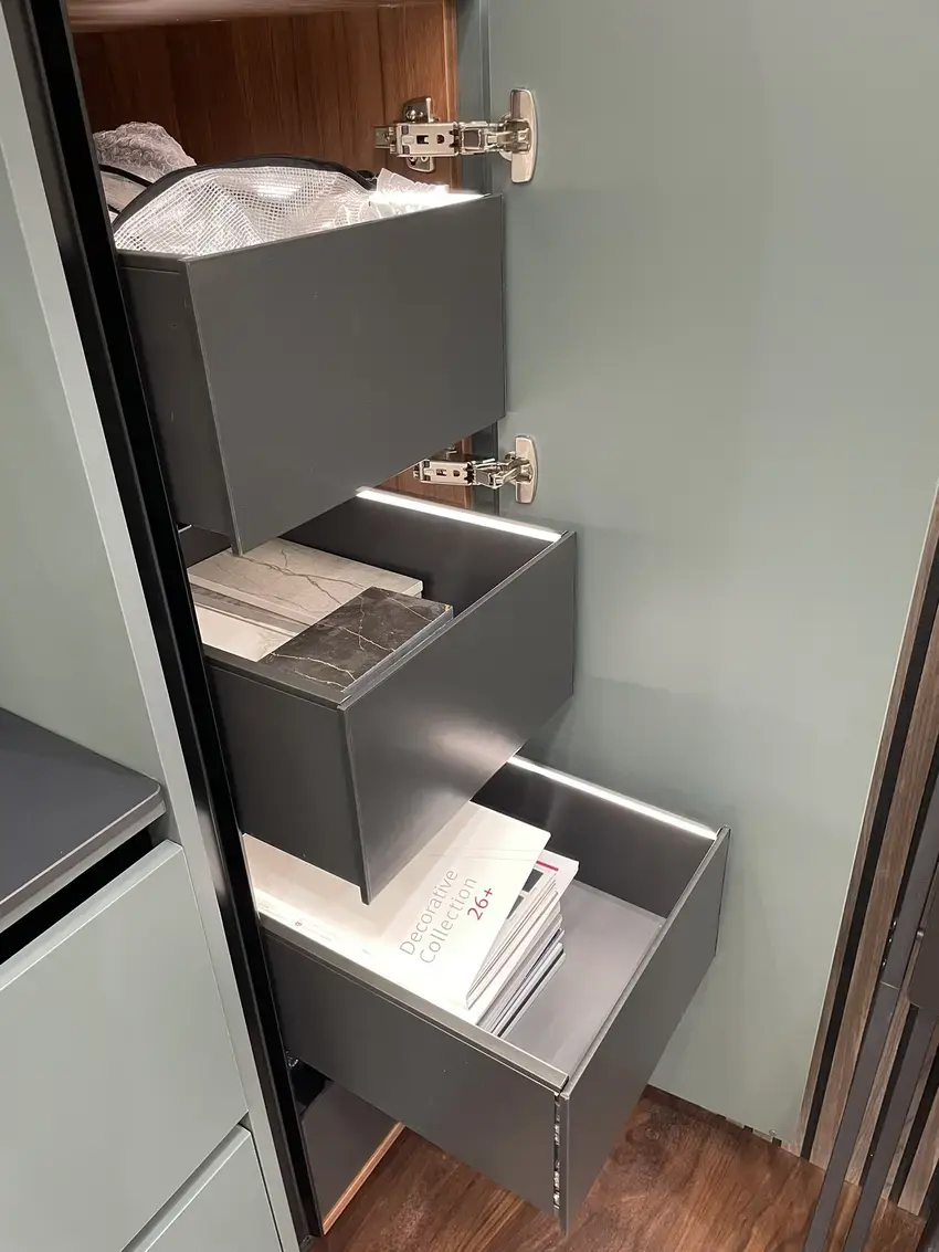 sustique engineered kitchen range demonstrator showing top lit drawer boxes in larder unit
