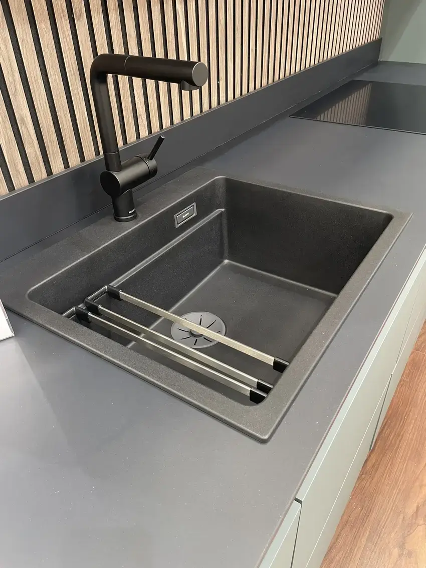 sustique engineered kitchen range showing porcelain worktop sink and tap