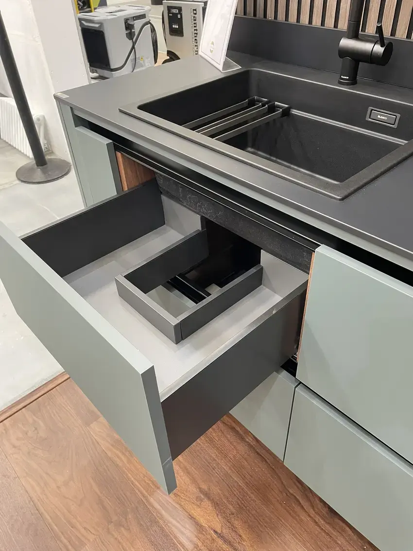 sustique engineered kitchen range demonstrator showing sink drawer