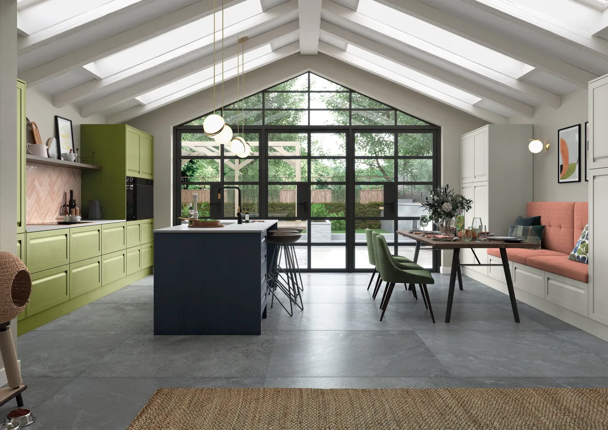 Shaker-style kitchen with integrated handles painted slate blue and citrus green