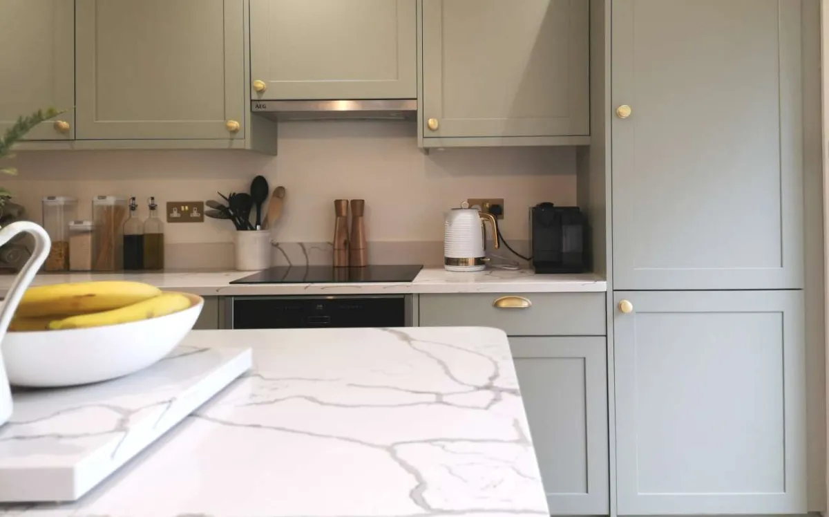 Contemporary shaker-style kitchen island painted sage green