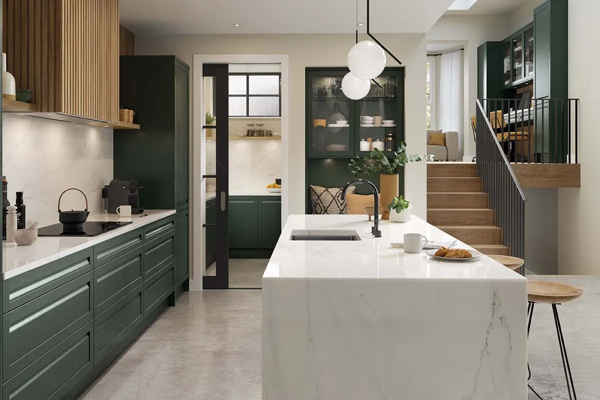 Shaker-style kitchen with integrated handle painted heritage green