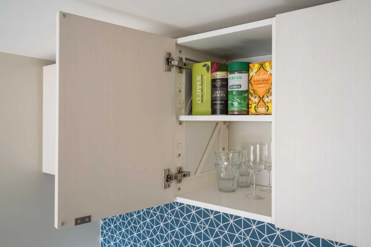 White Scandi style kitchen using Puustelli Miinus wall cabinets with separators