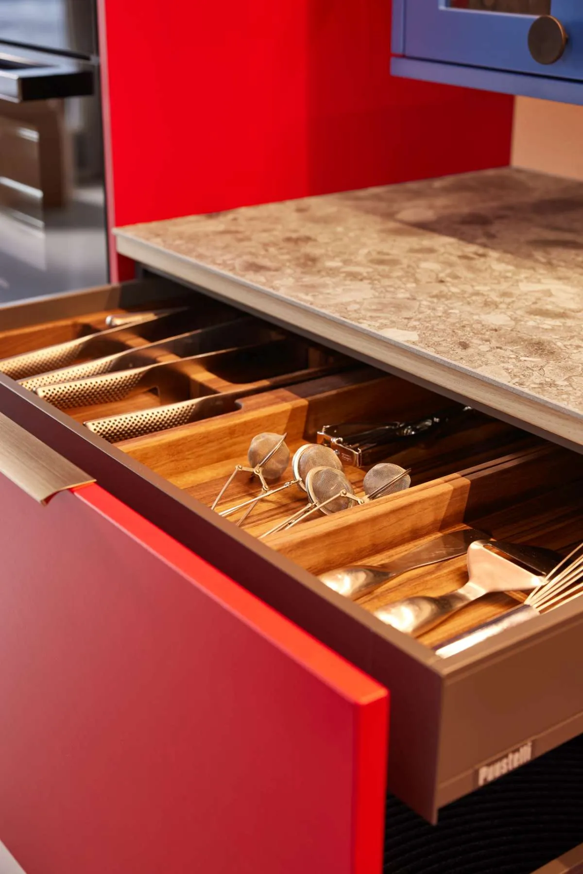 Modern style Puustelli Miinus kitchen showing solid wood cutlery insert