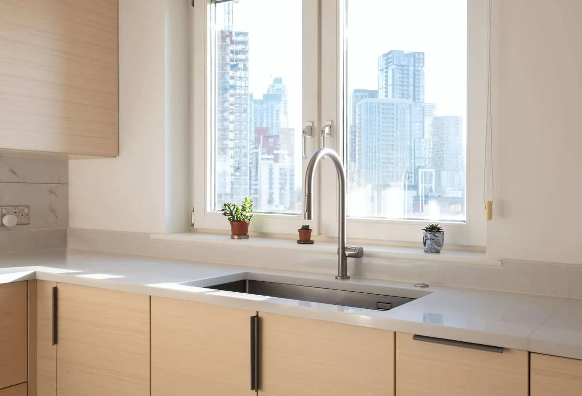 Scandi style kitchen showing large undermounted sink with quartz worktop