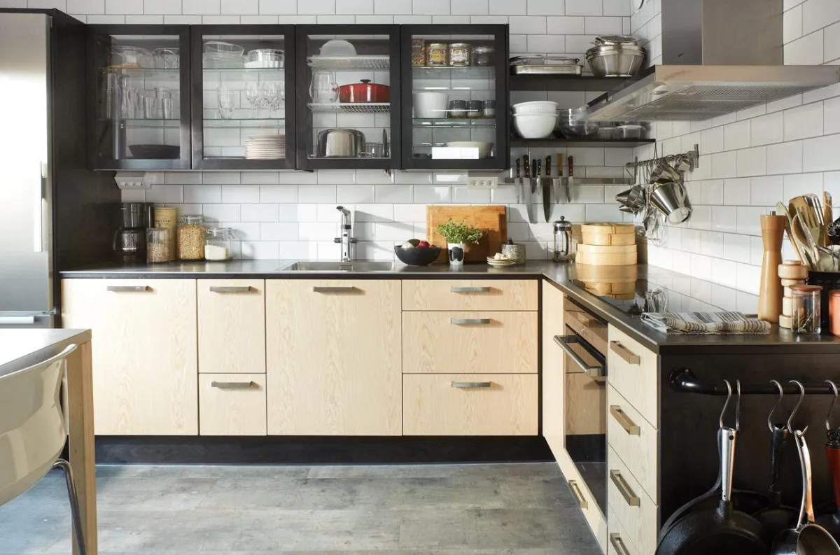 Puustelli Miinus kitchen with lacquered birch veneer doors, lava bio-composite frames, and dark stained glazed doors and trims