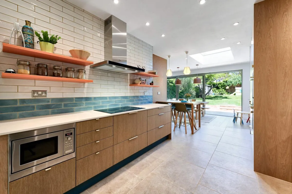 Puustelli Miinus kitchen with wild brown birch veneer cabinetry and white ceramic worktops